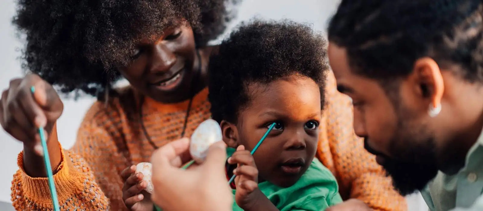 parents and kid with coloring books